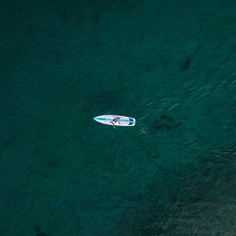 aerial image of the solo sup backcountry paddleboard on a lake