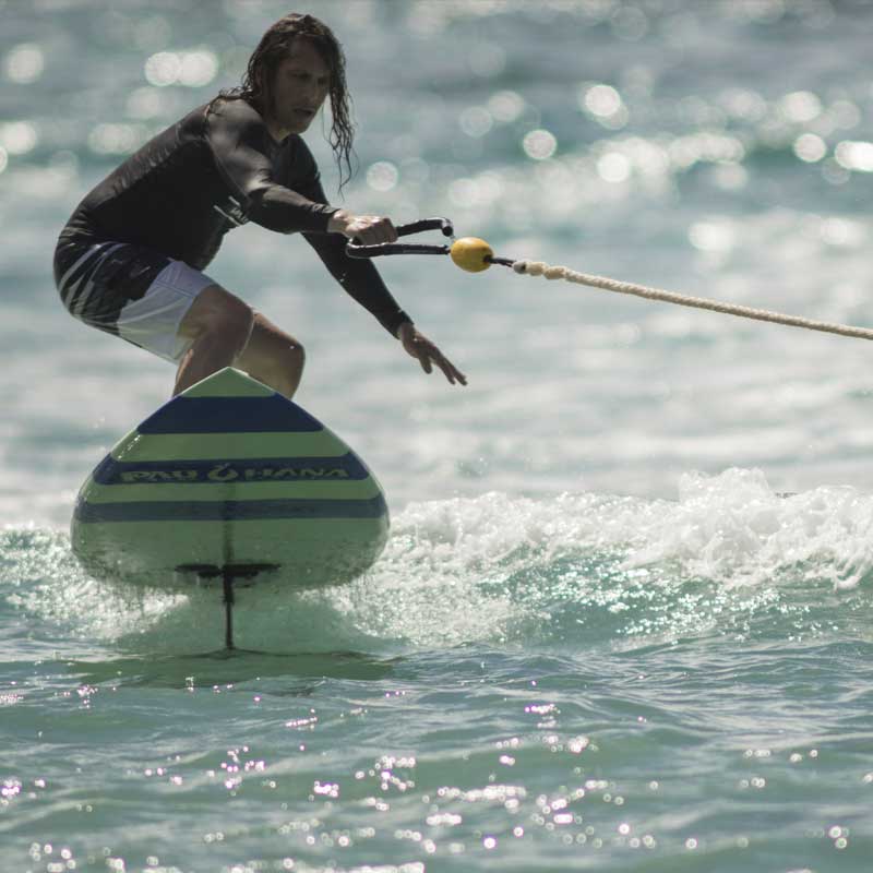 A person hydrofoiling on the carve pro paddleboard