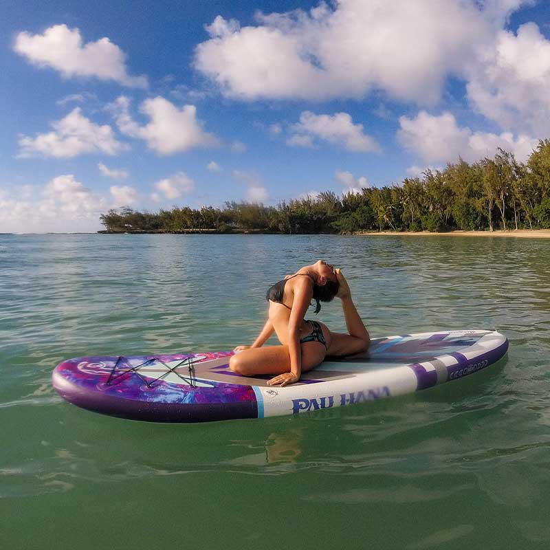 A girl doing yoga on the moonmist inflatable paddleboard